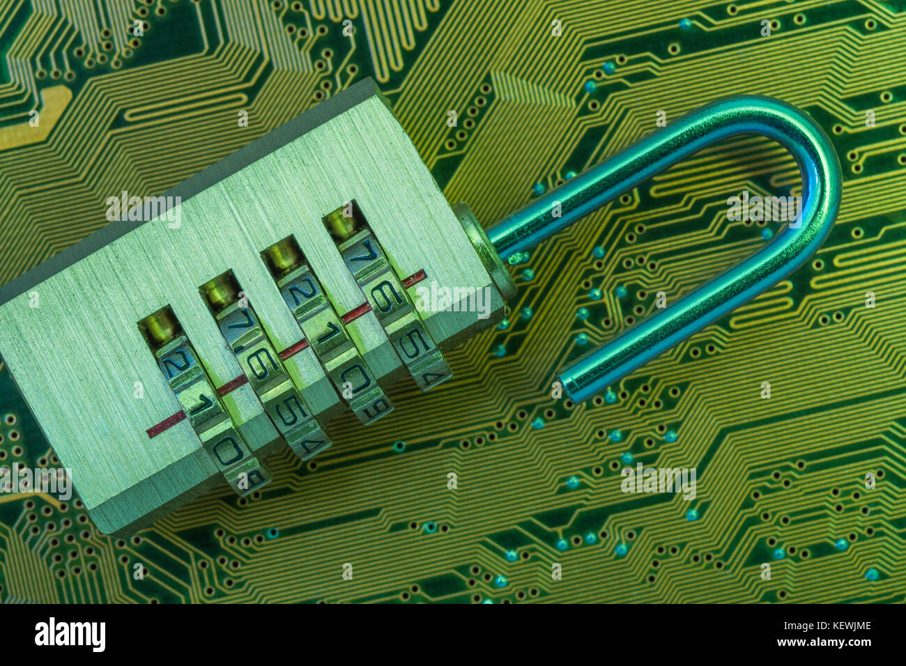 Closeup of small combination padlock on an an electronic circuit board