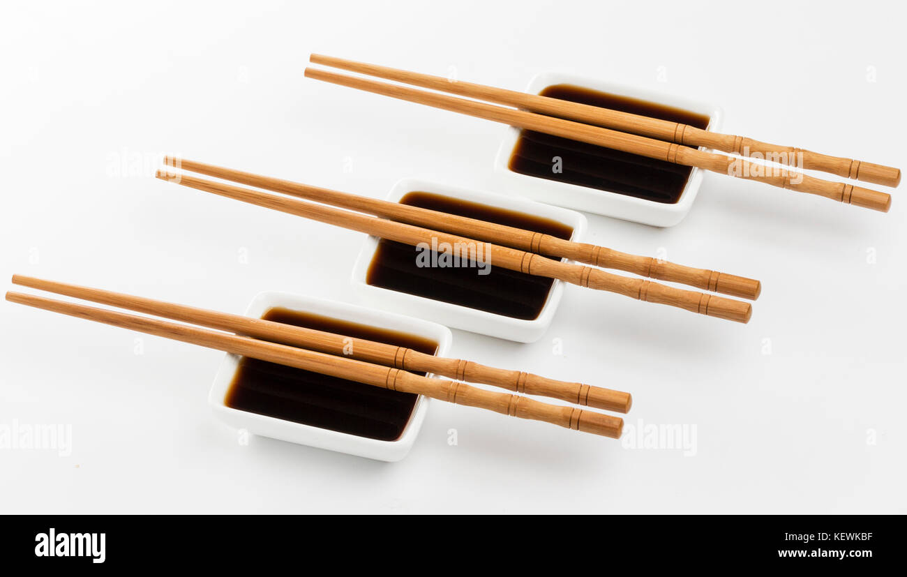 Three bowls of soy sauce isolated on white background Stock Photo