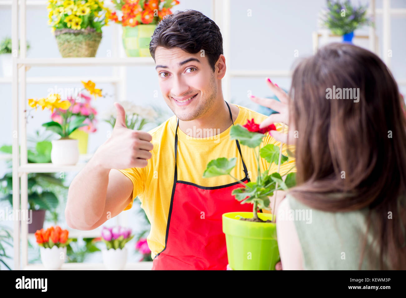 Florist selling flowers in a flower shop Stock Photo Alamy
