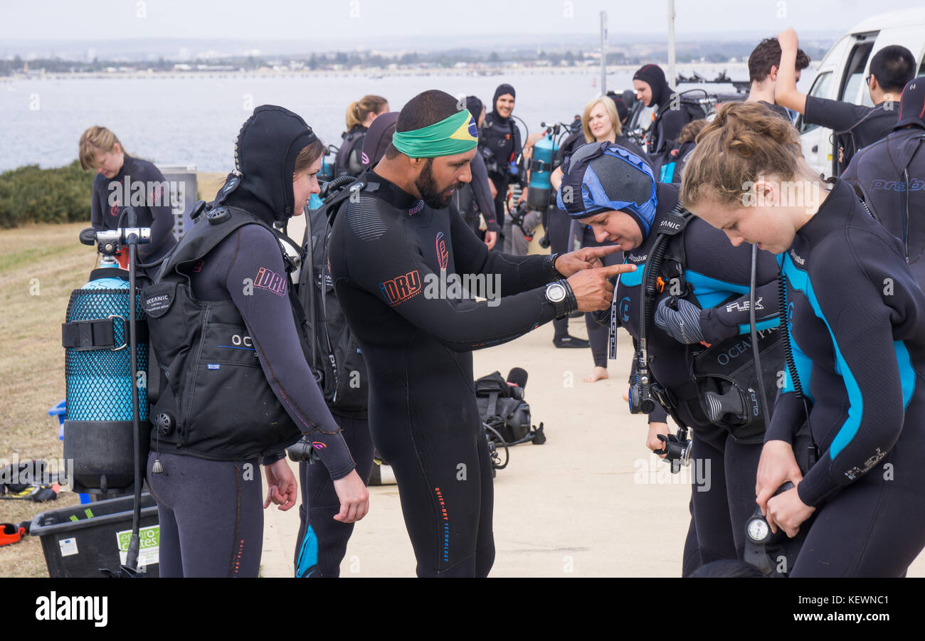 Scuba divers getting ready to dive Stock Photo