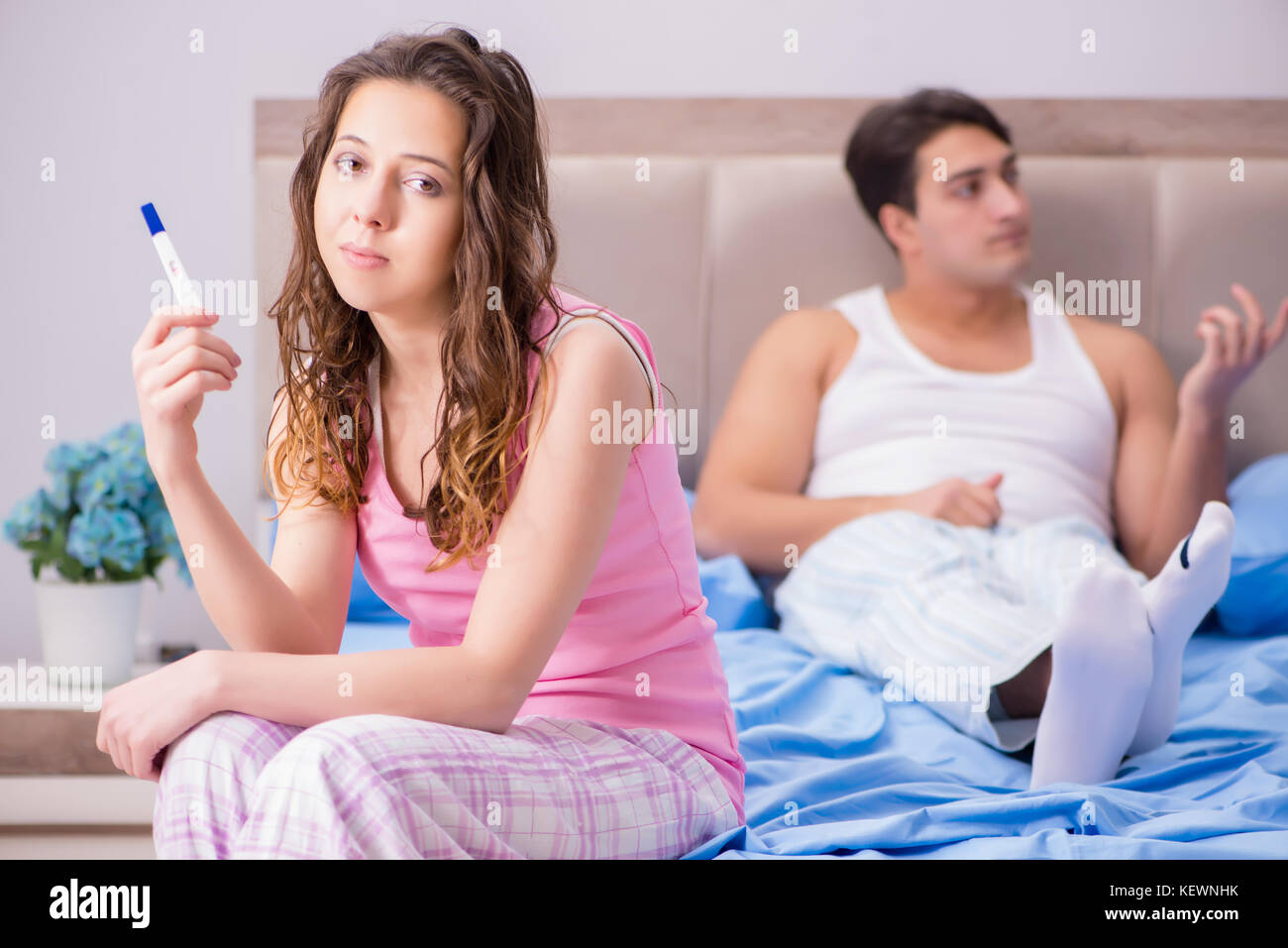 Young family with pregnancy test results Stock Photo Alamy