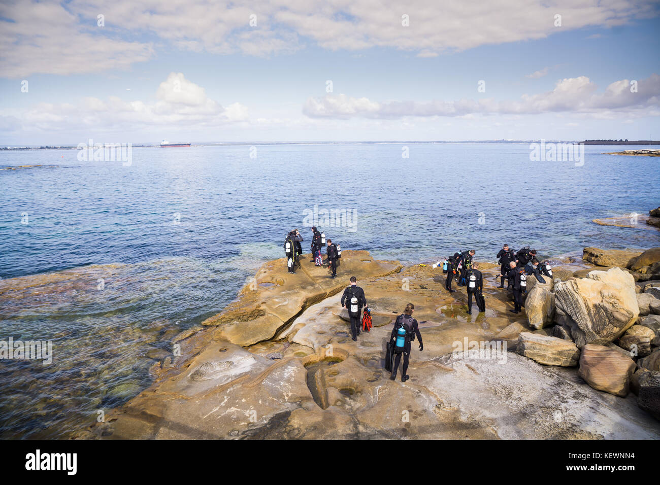 Scuba divers getting ready to dive Stock Photo