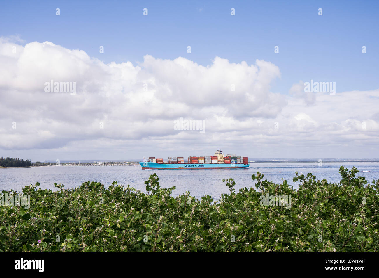 A container ship steams out of Botany Bay, Australia Stock Photo