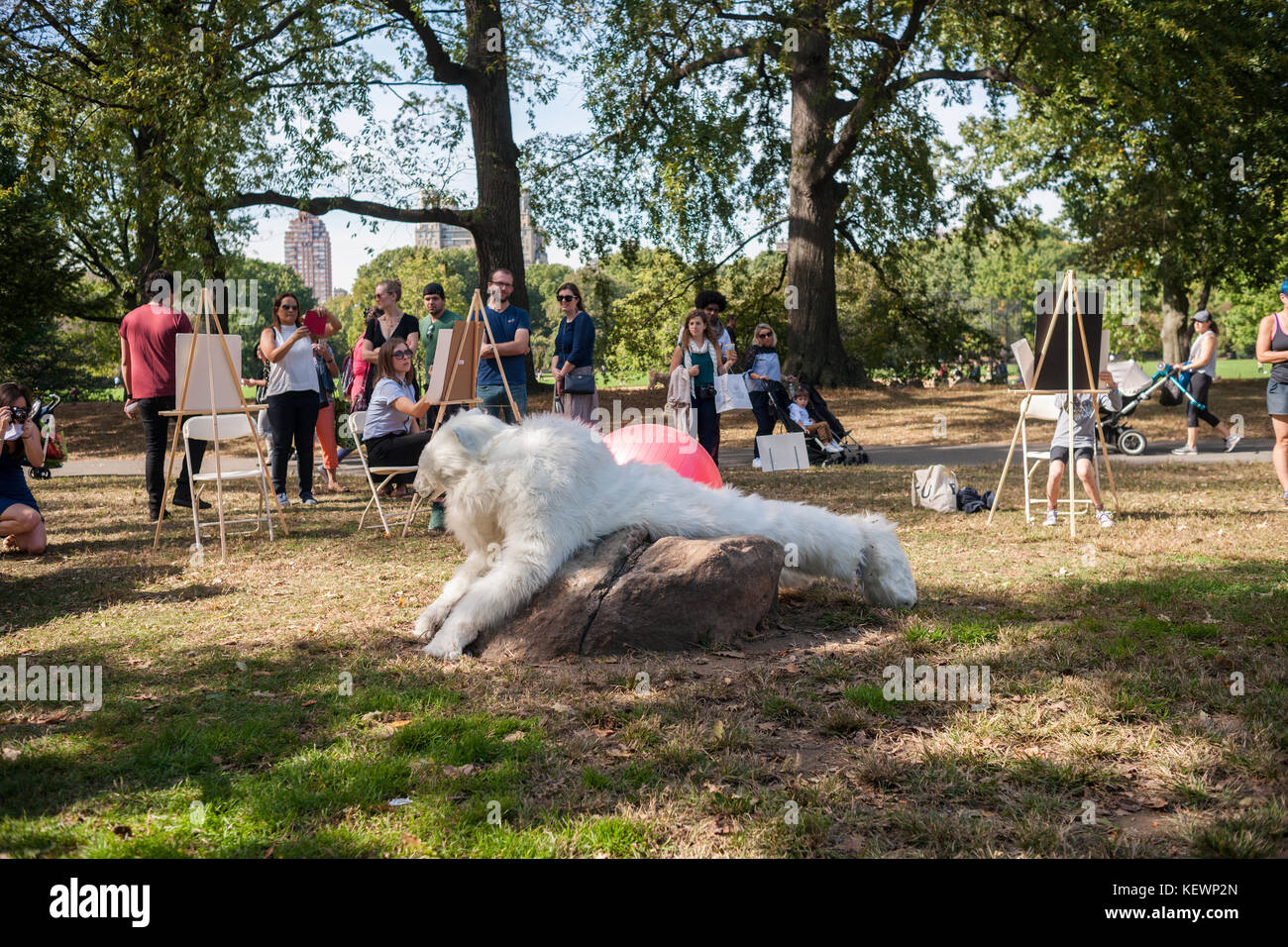 Visitors participate in Daniele Frazier's 'Ursus Excursus (How to Draw a Polar Bear)' 2007 at 'It's Happening'. Reminiscent of a 1960's 'happening' the Public Art fund brought performance, sculptures and other artists to Central Park for 'It's Happening!' on Saturday, October 21, 2017. Thousands of visitors came to Central Park's East Pinetum to experience performance art, sculpture and to get their hands dirty creating their own artworks.  (© Richard B. Levine) Stock Photo