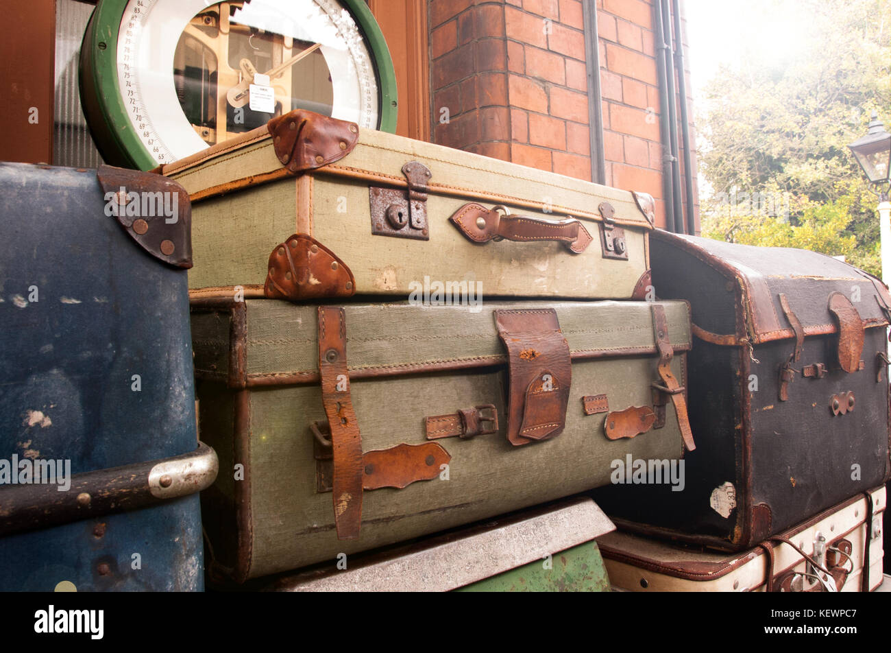 Vintage luggage stacked on a train station platform Stock Photo