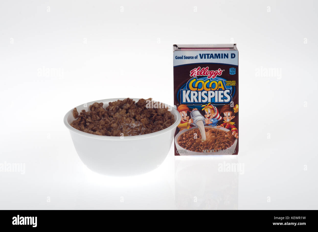 Bowl of Kellogg's Cocoa Krispies Cereal in milk with box on white background  USA Stock Photo