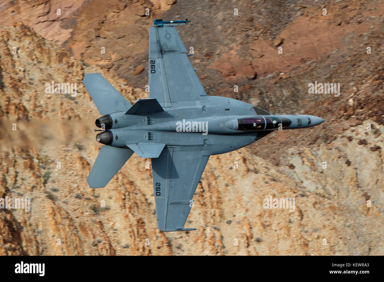 Boeing F/A-18F Super Hornet (XE-260) from the United States Navy VX-9 Vampires squadron, Naval Air Weapons Station China Lake, flies low level through the Jedi Transition, Star Wars Canyon, Death Valley National Park, California, United States of America Stock Photo