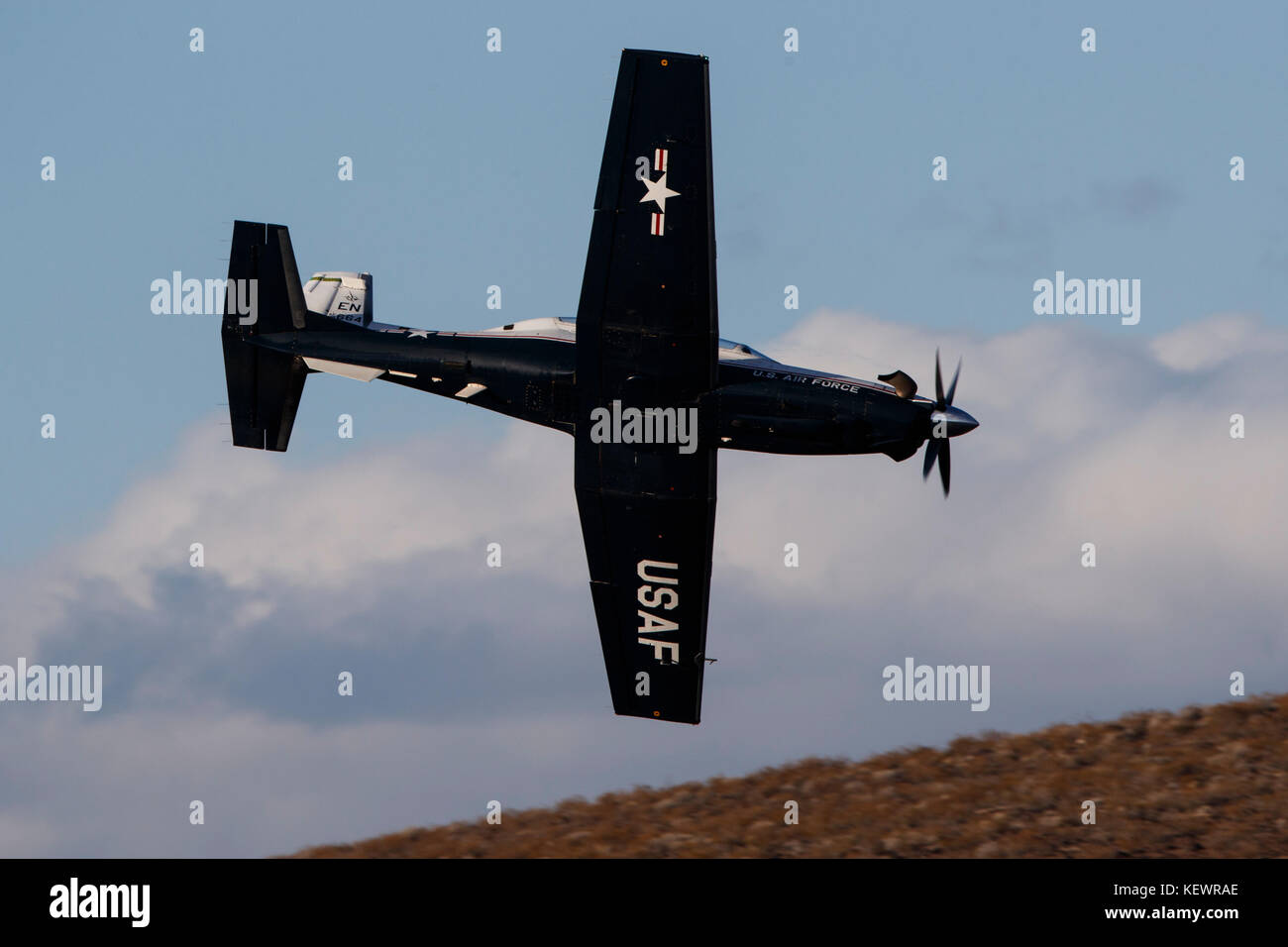 Beechcraft T-6 Texan II from United States Air Force 80th Flying Training Wing, Sheppard Air Force Base, Texas, flies low level through the Jedi Transition, Star Wars Canyon, Death Valley National Park, California, United States of America Stock Photo