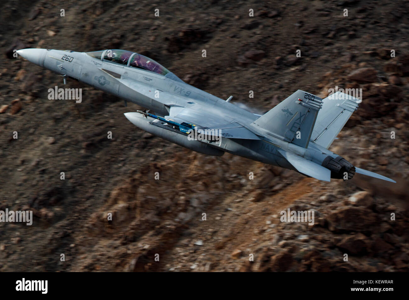 Boeing F/A-18F Super Hornet (XE-260) from the United States Navy VX-9 Vampires squadron, Naval Air Weapons Station China Lake, flies low level through the Jedi Transition, Star Wars Canyon, Death Valley National Park, California, United States of America Stock Photo