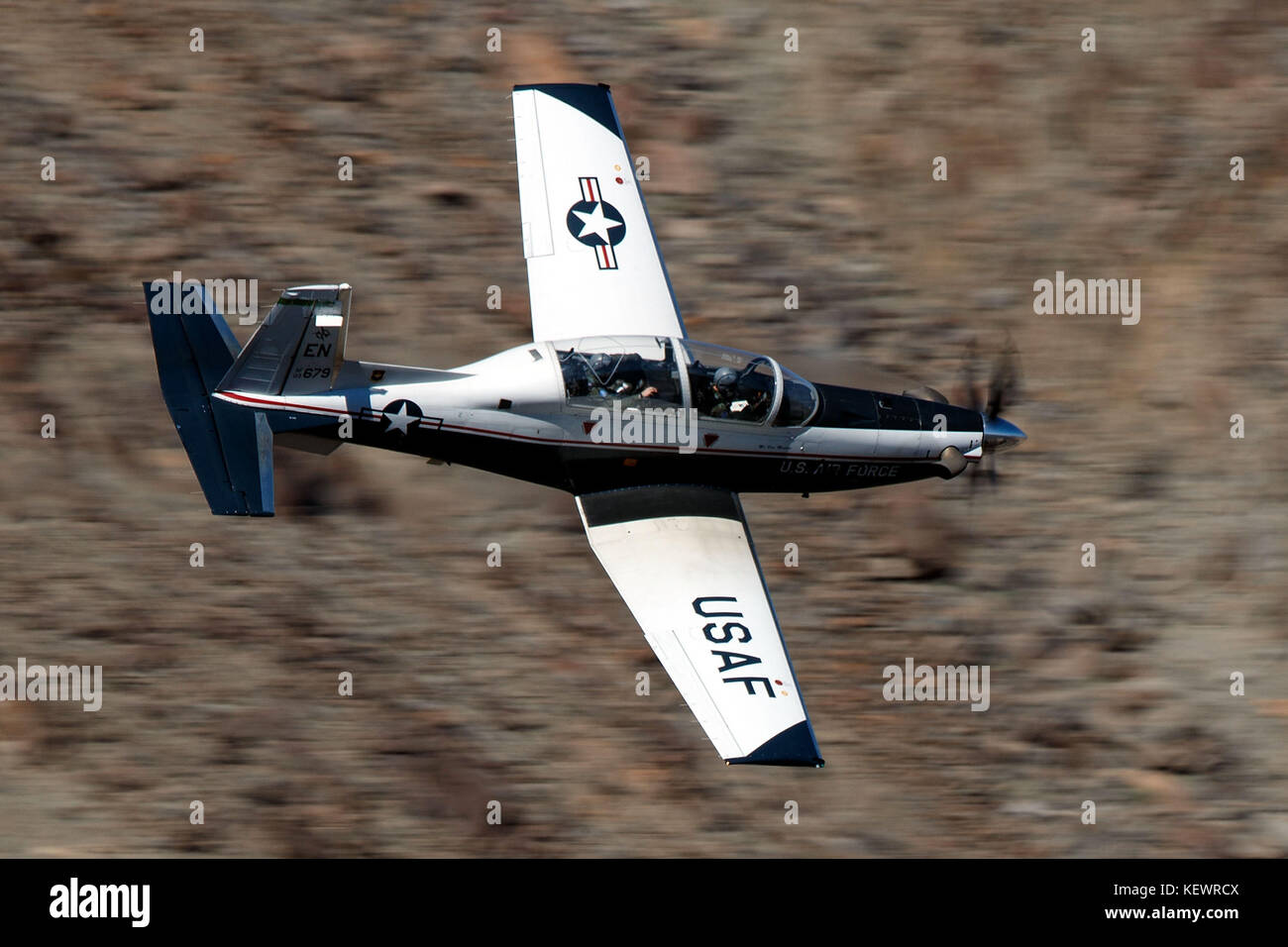 United States Air Force Beechcraft T-6 Texan II (03-679) from the 80th Flying Training Wing, Sheppard Air Force Base, Texas, flies low level through the Jedi Transition, Star Wars Canyon, Death Valley National Park, California, United States of America Stock Photo