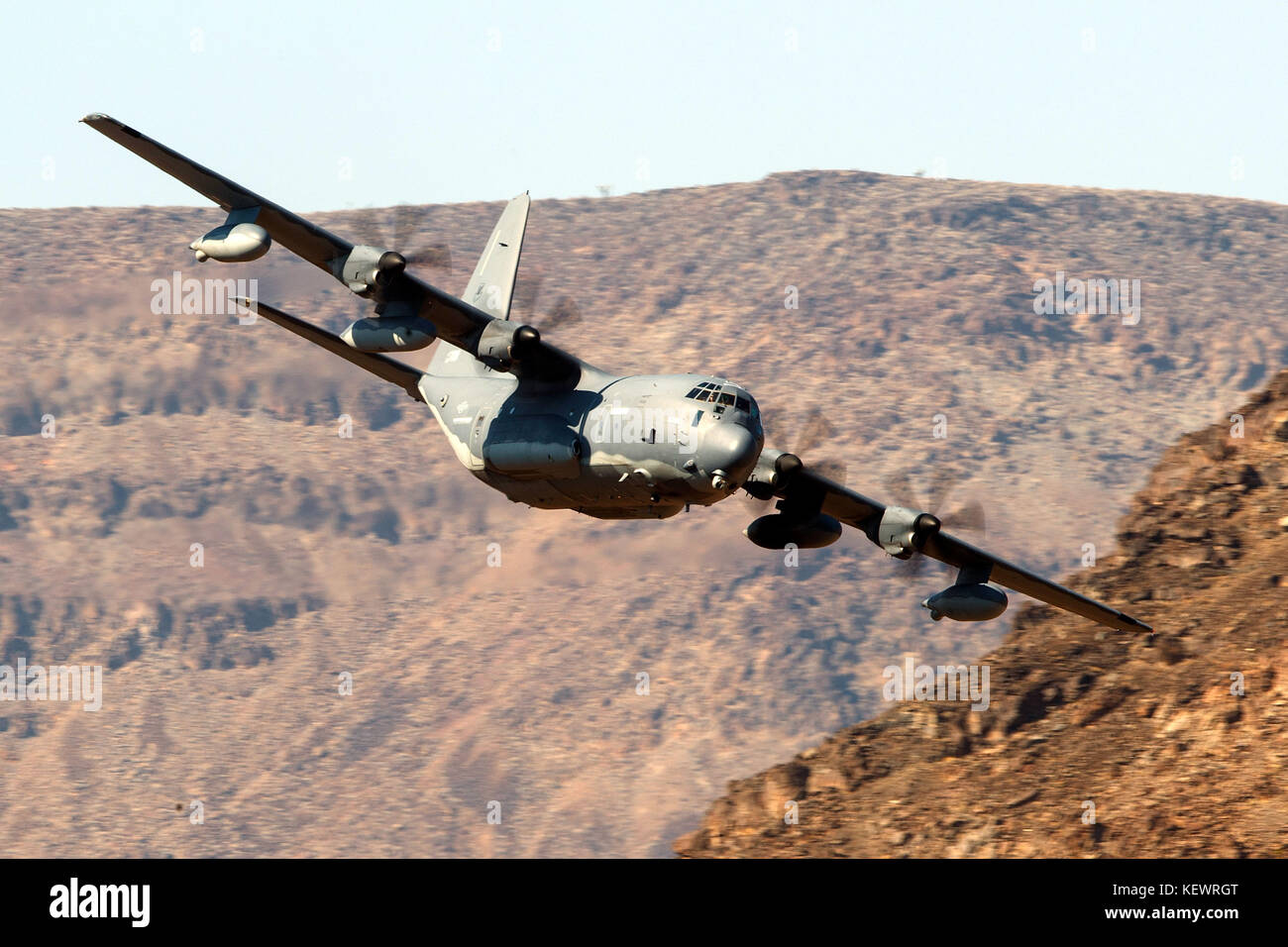 United States Air Force Lockheed HC-130J Combat King II from the 79th Rescue Squadron, Davis-Monthan Air Force Base, flies low level on the Jedi Transition through Star Wars Canyon / Rainbow Canyon, Death Valley National Park, Panamint Springs, California, United States of America Stock Photo