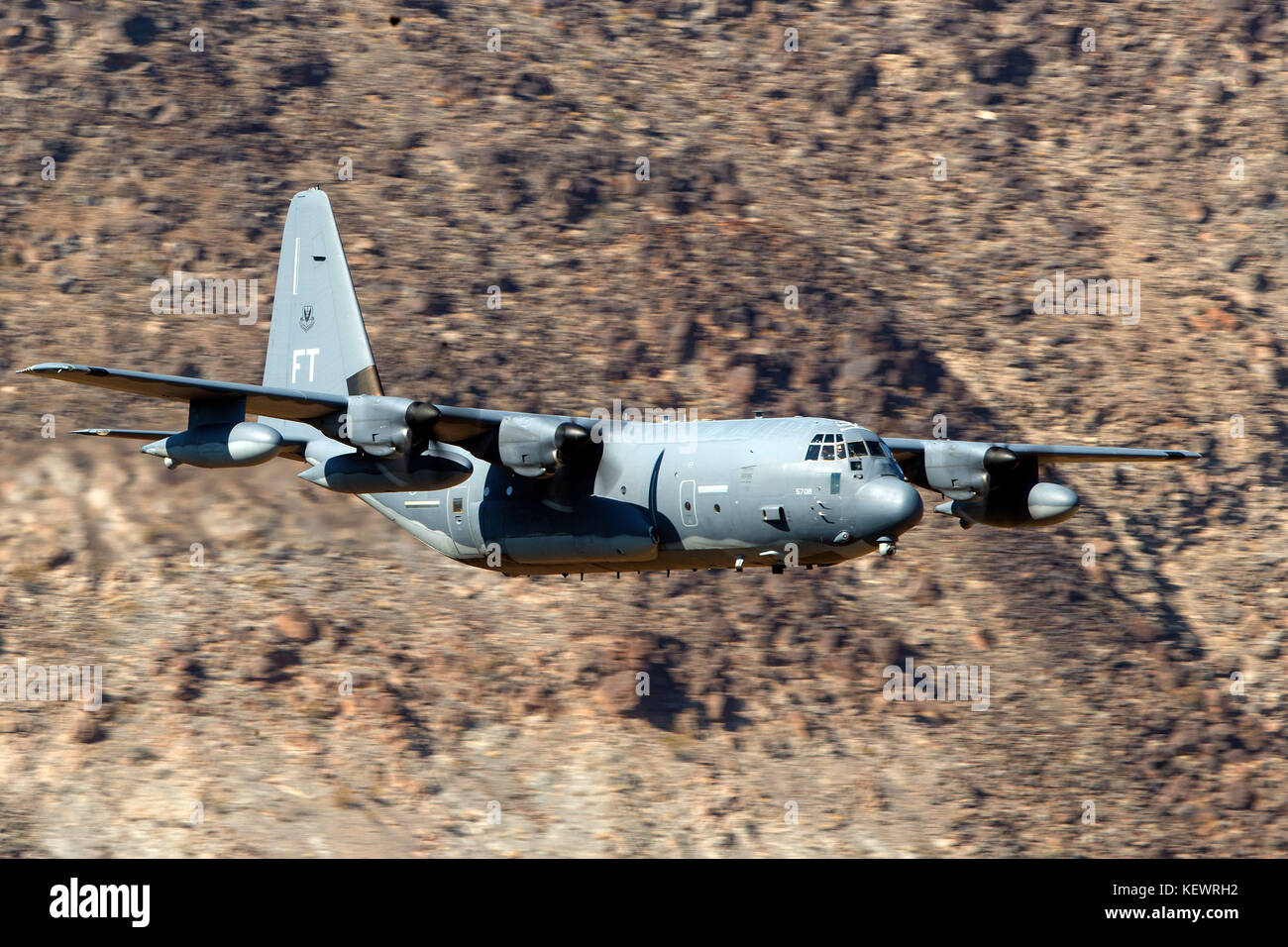 United States Air Force Lockheed HC-130J Combat King II from the 79th Rescue Squadron, Davis-Monthan Air Force Base, flies low level on the Jedi Transition through Star Wars Canyon / Rainbow Canyon, Death Valley National Park, Panamint Springs, California, United States of America Stock Photo