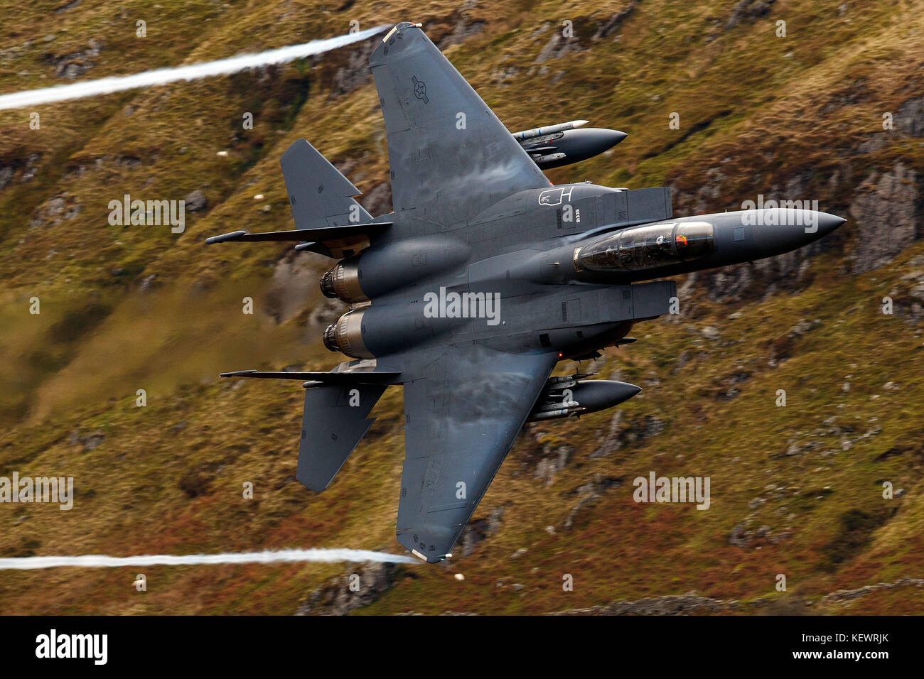 United States Air Force McDonnell-Douglas F-15E Strike Eagle (LN 91-335) from the 48th Fighter Wing, 494th Fighter Squadron based at RAF Lakenheath, England, flies low level through the Mach Loop, Machynlleth, Wales, United Kingdom Stock Photo