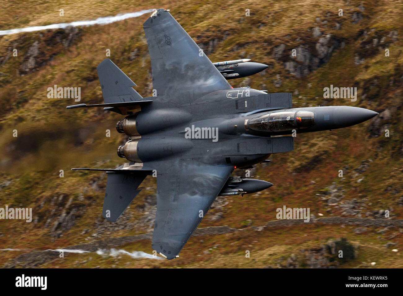 United States Air Force McDonnell-Douglas F-15E Strike Eagle (LN 91-335) from the 48th Fighter Wing, 494th Fighter Squadron based at RAF Lakenheath, England, flies low level through the Mach Loop, Machynlleth, Wales, United Kingdom Stock Photo