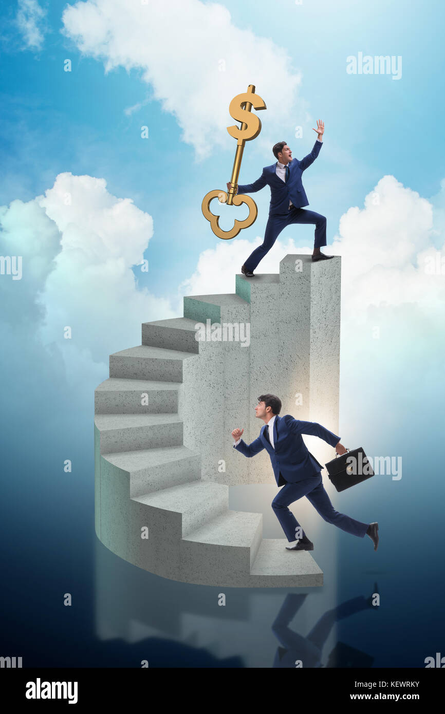 Businessman with key to success at the top of career Stock Photo - Alamy