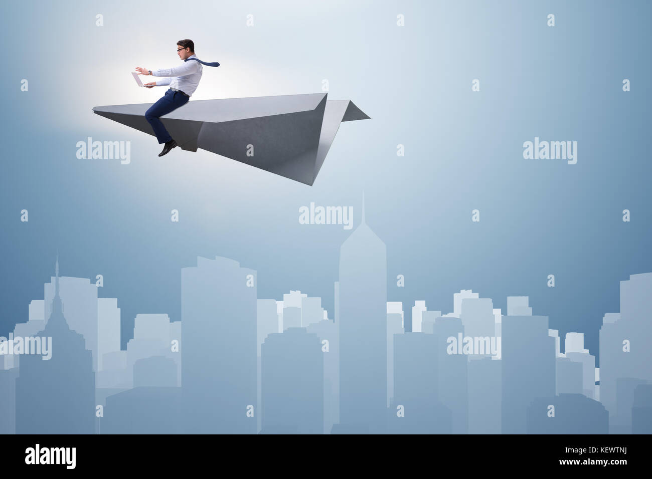 Businessman flying on paper plane in business concept Stock Photo - Alamy