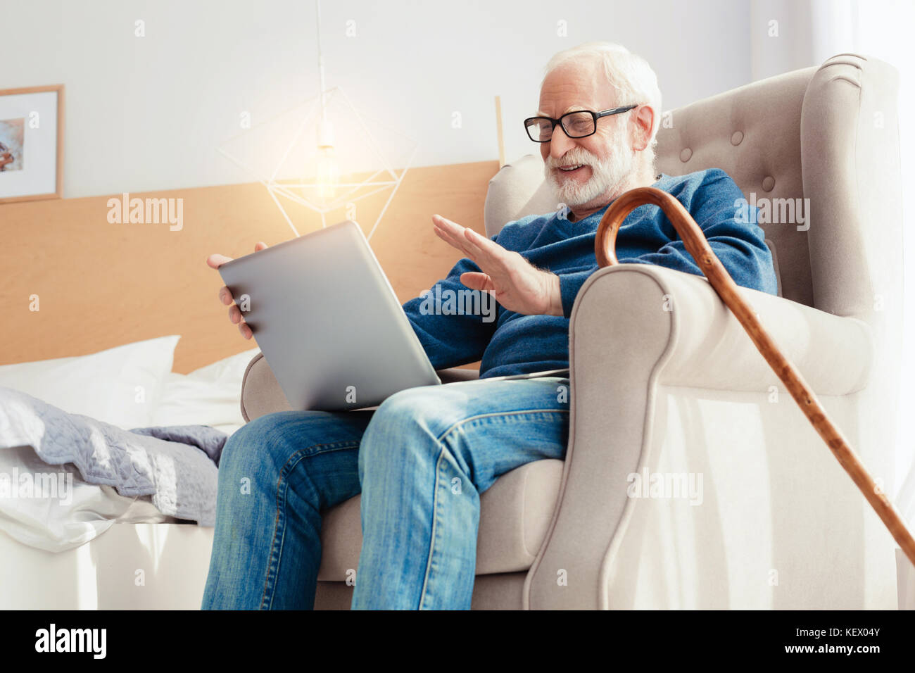 Happy retirement talking online with relatives Stock Photo