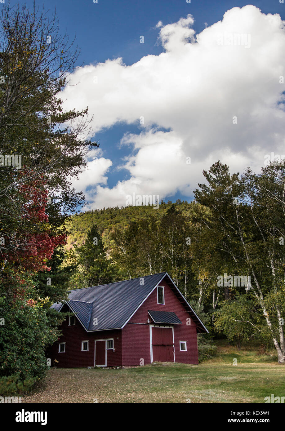 New Hampshire farm house nestled in the trees Stock Photo Alamy