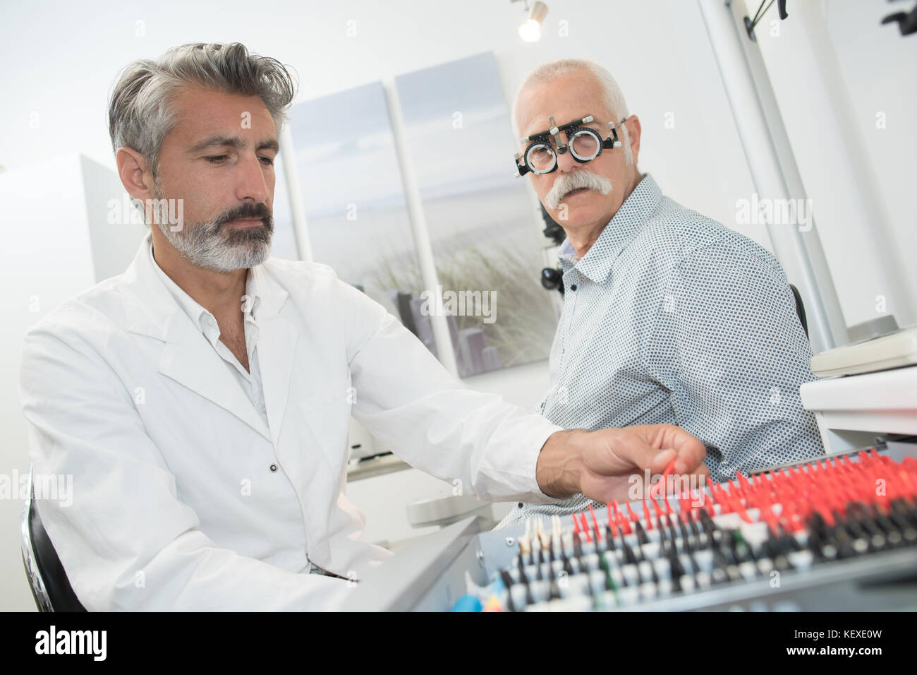 doctor testing different eye test lens Stock Photo