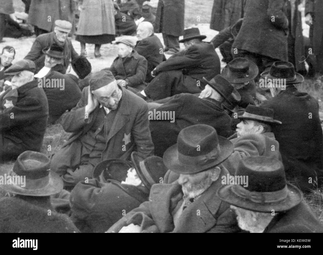 Birkenau Men waiting in the grove close to gas chamber no 4 to be exterminated Stock Photo