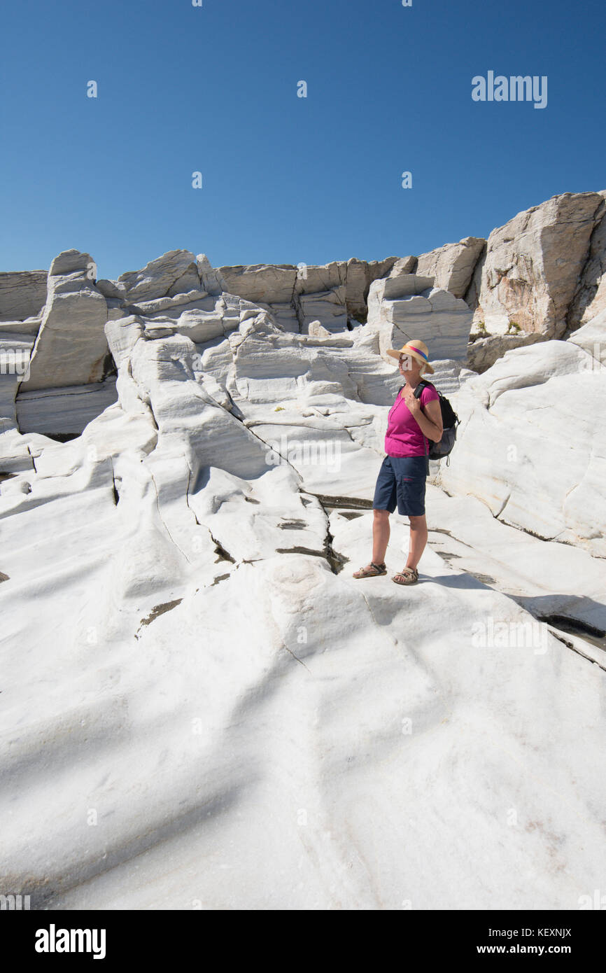 woman visitor in the ancient marble quarry on the promontory at Aliki, Thassos, Greece, Greek island, September, Stock Photo