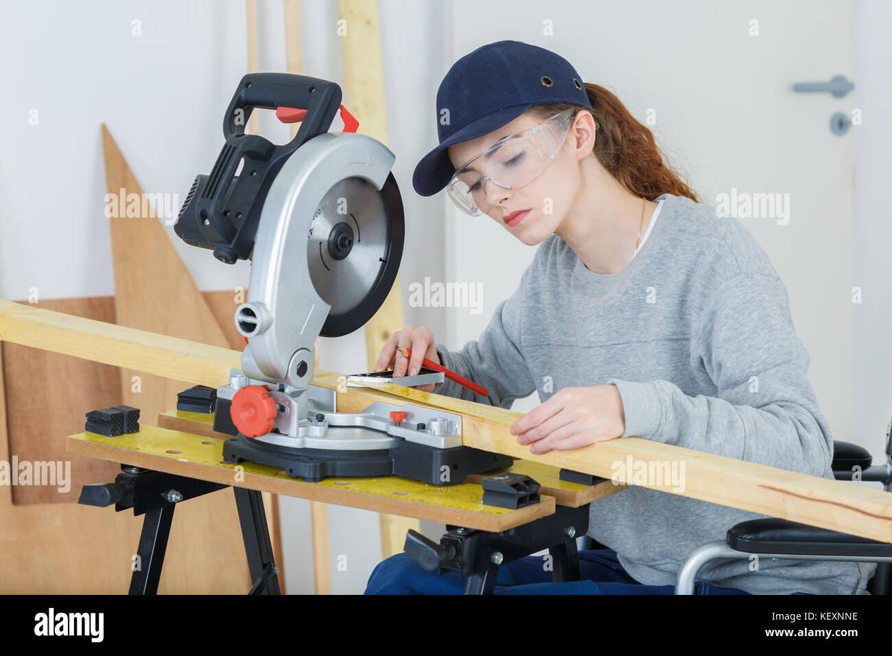 young latin female carpenter measuring and marking wood Stock Photo Alamy