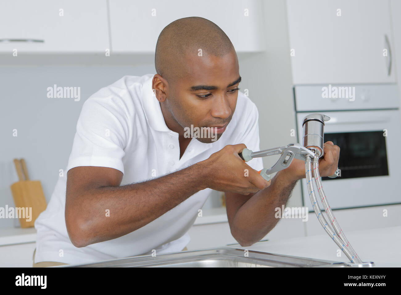 disconnecting the faucet pipe Stock Photo Alamy