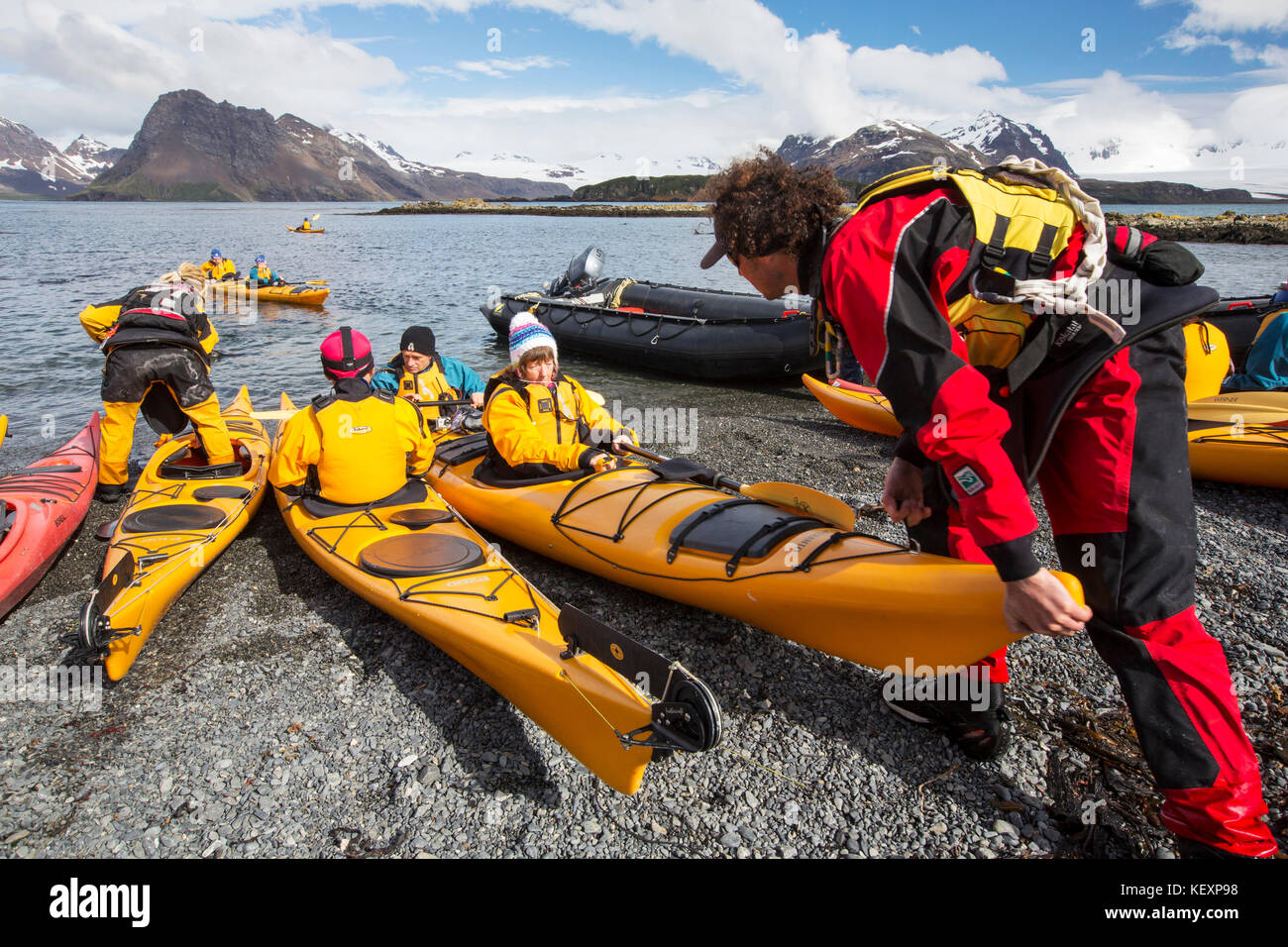 Tourists sea kayaking on Prion Island, South part of an