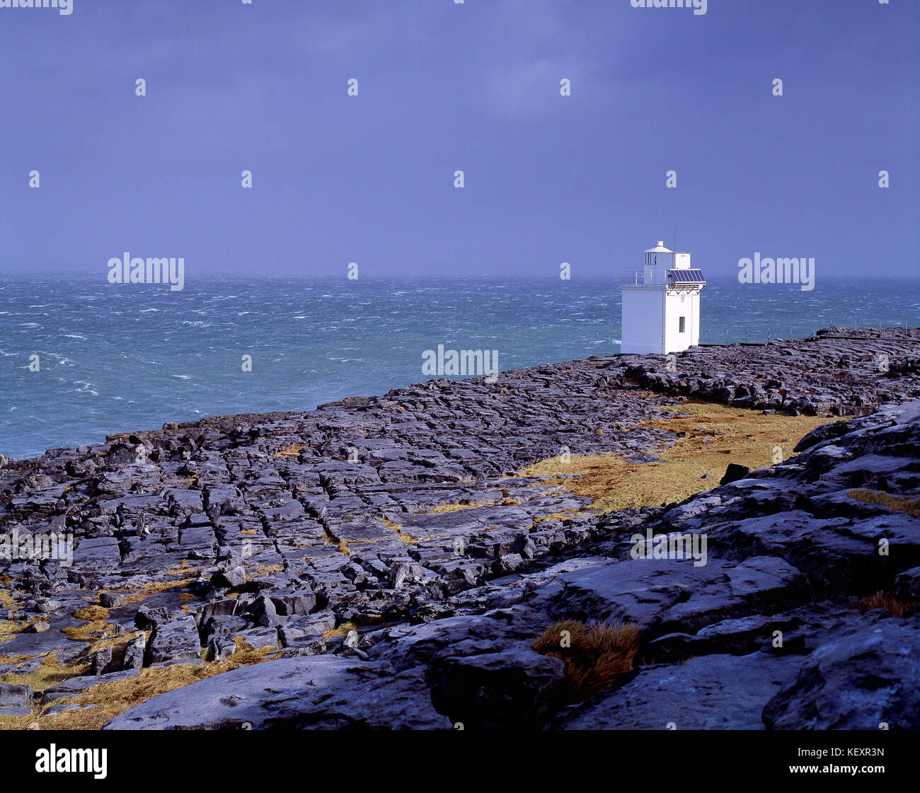 Ireland. County Clare. Coast with Blackhead Lighthouse.The Burren limestone pavement. Stock Photo