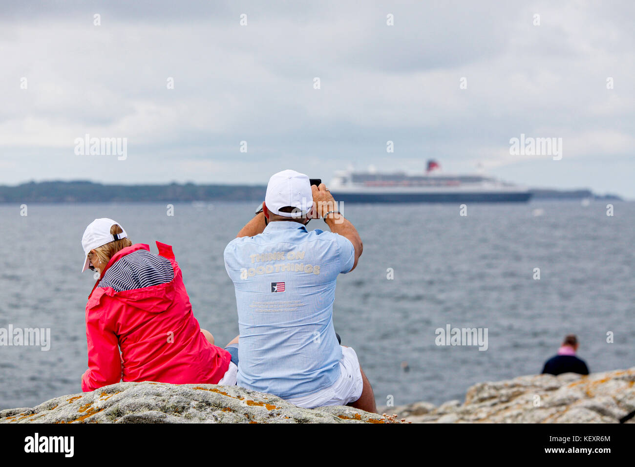 the Queen Mary 2 passing Groix Island, on her way to Saint Nazaire for the start of the centennial Transat The Bridge 2017, a historic transatlantic race between her and a fleet of giant trimarans. Stock Photo