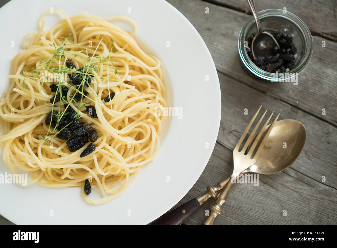 Pasta with roasted pine nuts and fresh cress Stock Photo - Alamy