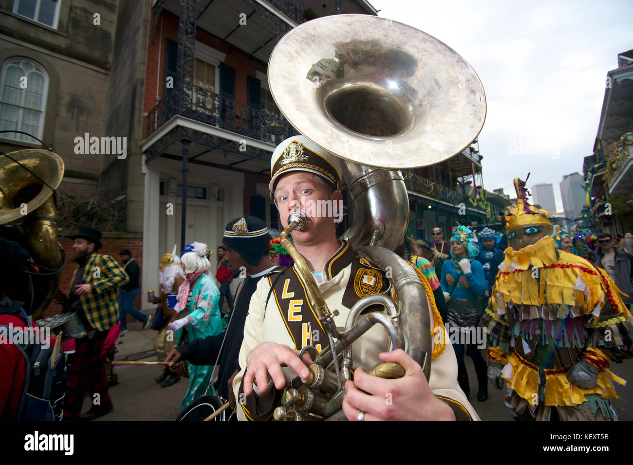 A brass band leads a second line parade in New Orleans, Louisiana on Mardi Gras Day Stock Photo