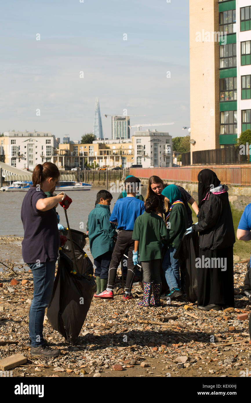 Volunteer clean up of the river Thames in London. Plastic pollution in our rivers and seas is being recognised as a major problem. Stock Photo
