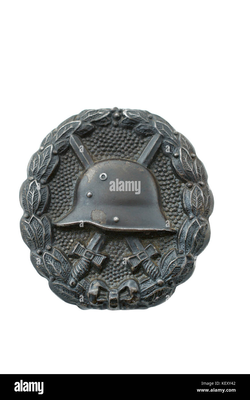 German breastplate (badge) for wounding at the WWI. In bronze. Established at 1918. Path at white background. Stock Photo