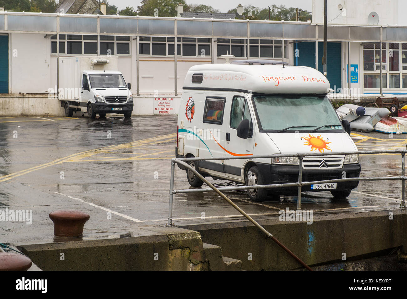 Camper van with people inside on Schull Pier, Schull, Ireland. Stock Photo