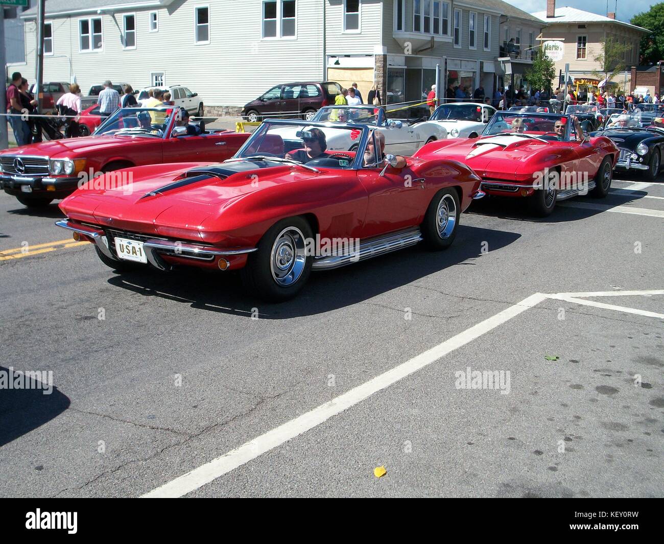 Two red Corvettes on Main Street, Watkins Glen, NY for Grand Prix