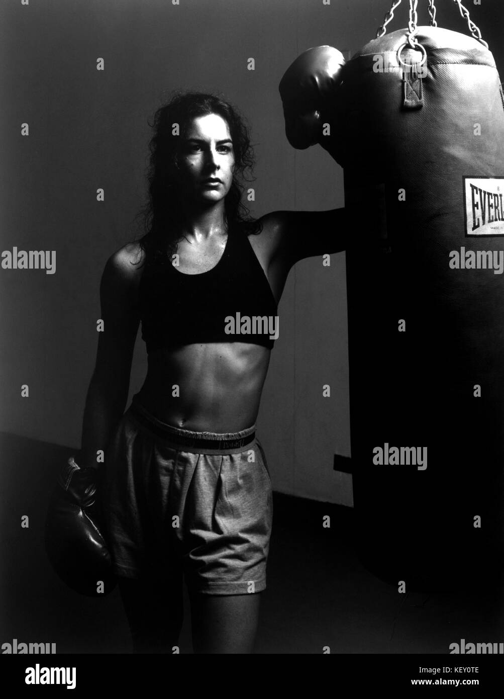 Woman/Girl in boxing gym after workout Stock Photo