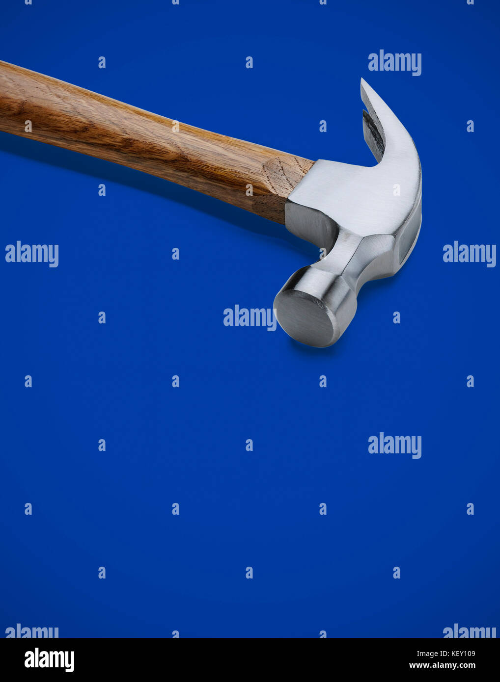 Claw hammer for construction on blue background Stock Photo - Alamy