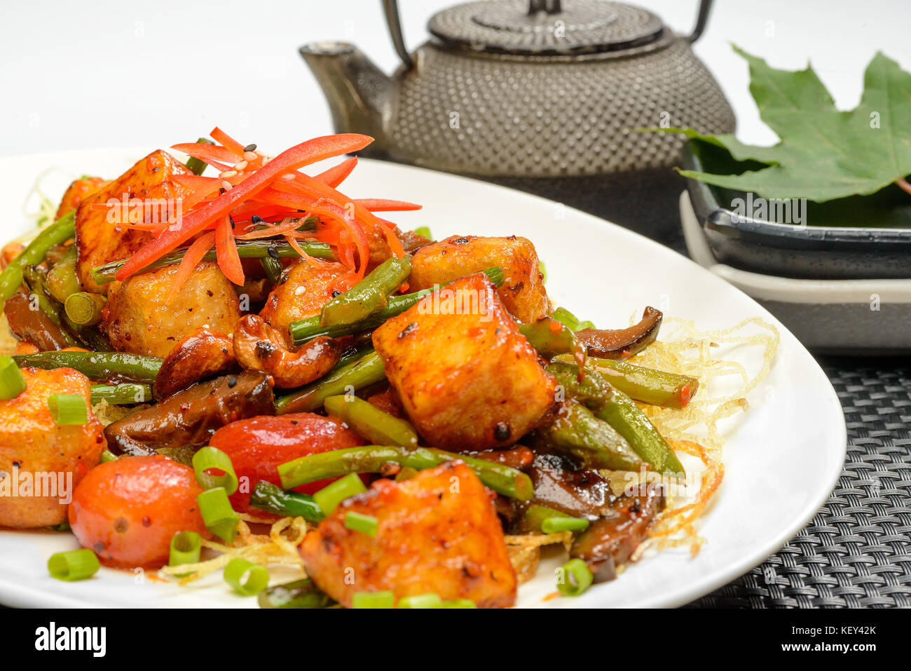 Fried tofu in sauce Stock Photo - Alamy