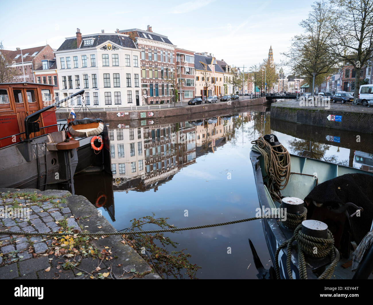 old harbour with houseboats in the old city of groningen in holland  Stock Photo