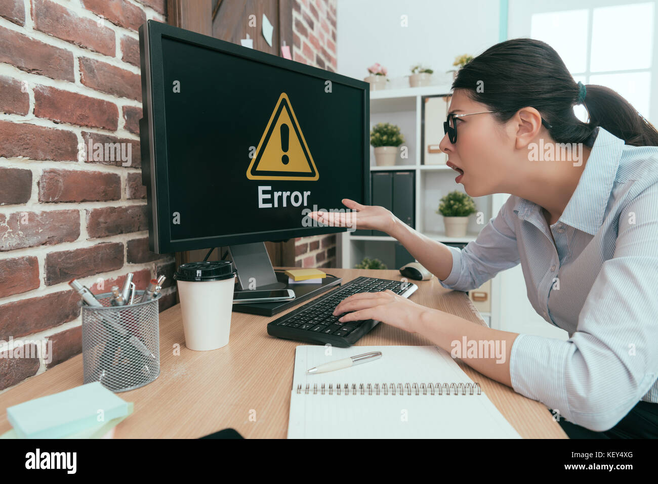 sadness suit woman sitting on working desk using keyboard typing making ...