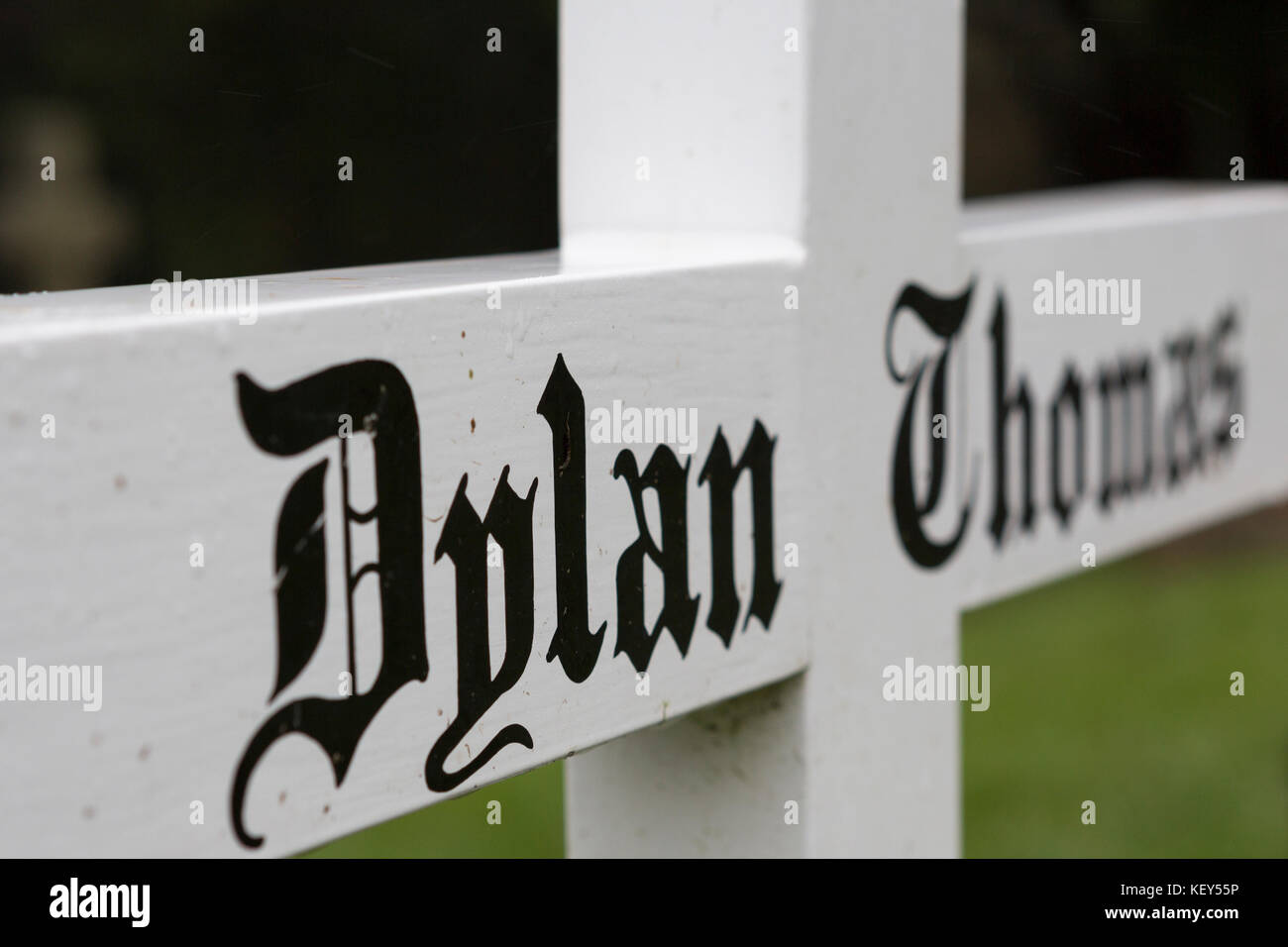 Simple white cross marking the grave of Welsh poet and writer Dylan ...