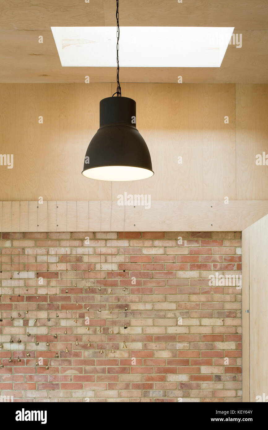Interior detail of light, brick and plywood. Phoenix Community Gardens