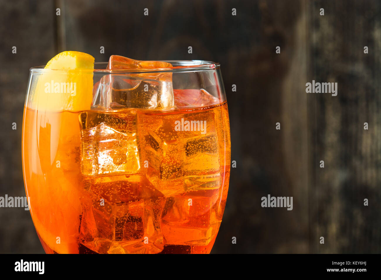 Aperol spritz cocktail in glass on wooden table Stock Photo