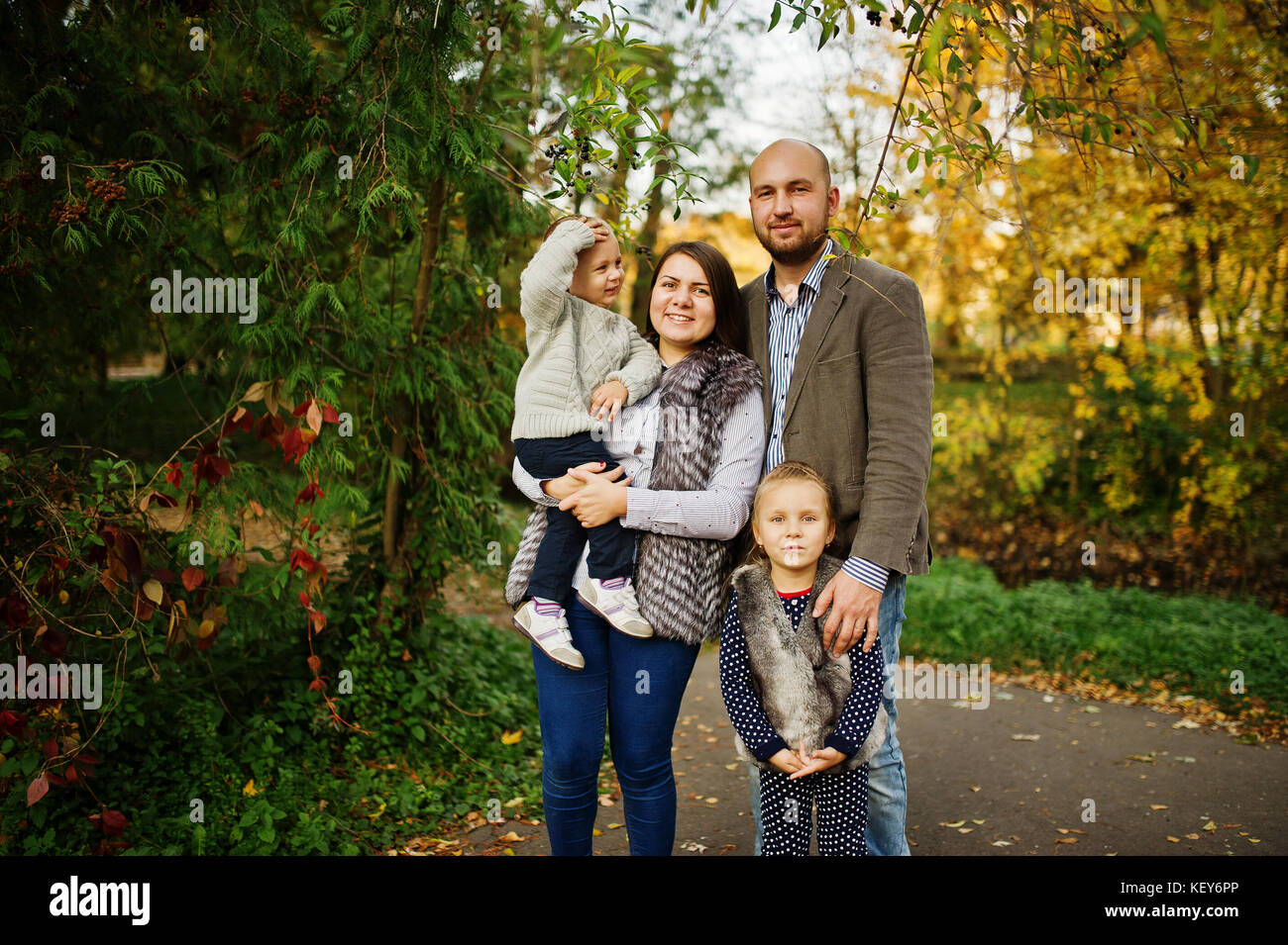 Happy caucasian family of mom dad and little girl with boy at majestic ...