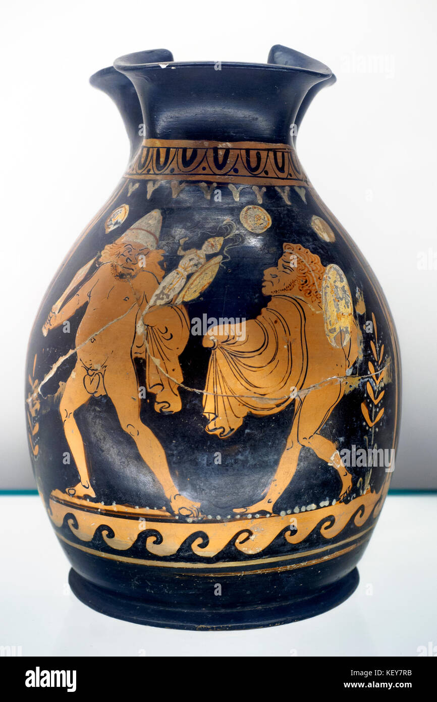 Red figured oinochoe (jug) A scene with a satyr play Made in Apulia about 370-360 BC, attributed to the Felton Painter The story of how Diomedes and Odysseus stole the Palladion (the statue of Athena) from Troy is shown here as a farce, with the heroes presented as grotesque caricatures Stock Photo