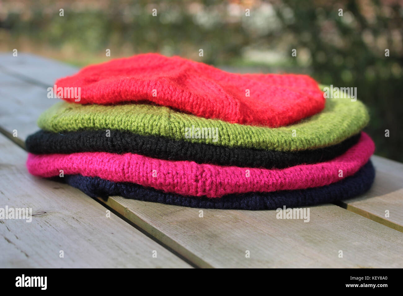 Five hand knitted Berets There is one child sized beret, the red
