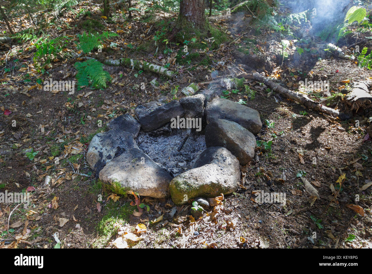 Unattended campfire at a campsite along the Carrigain Notch Trail near