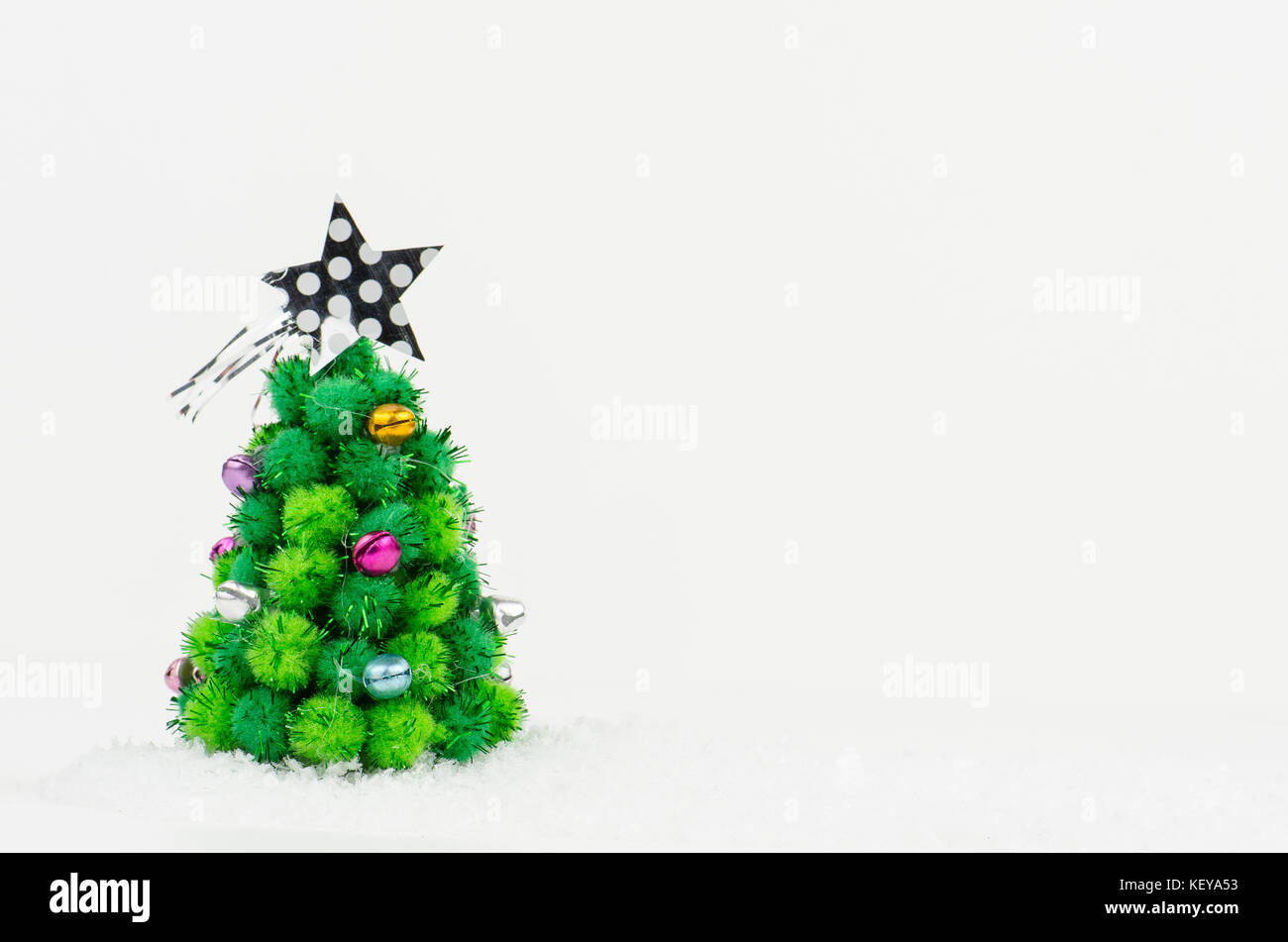 little Christmas tree isolated on white background Stock Photo - Alamy
