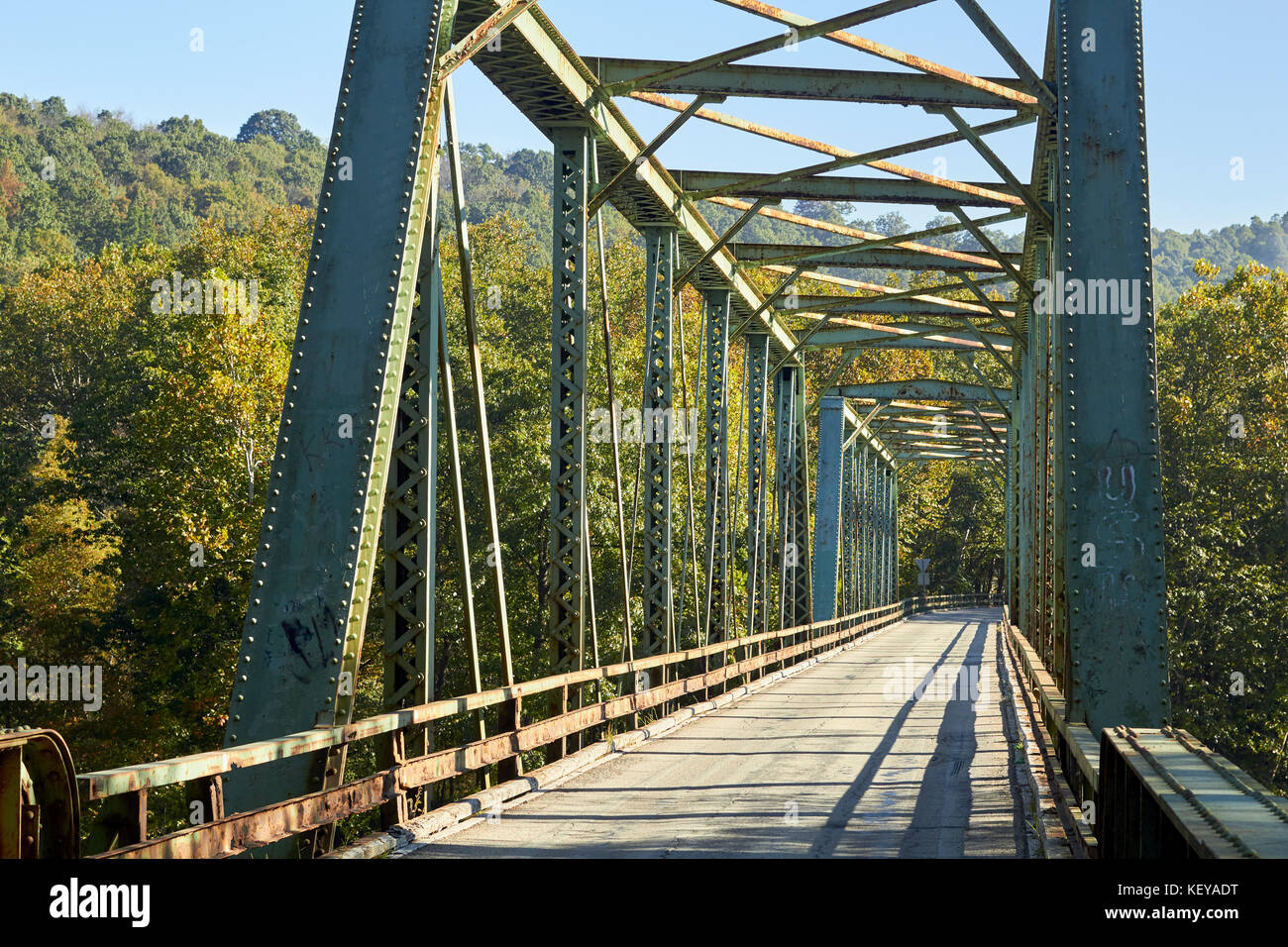 A country road crossing a steel trestle bridge at Perryopolis